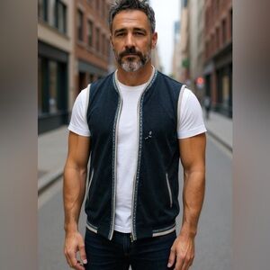 Leather trimmed fleece vest.